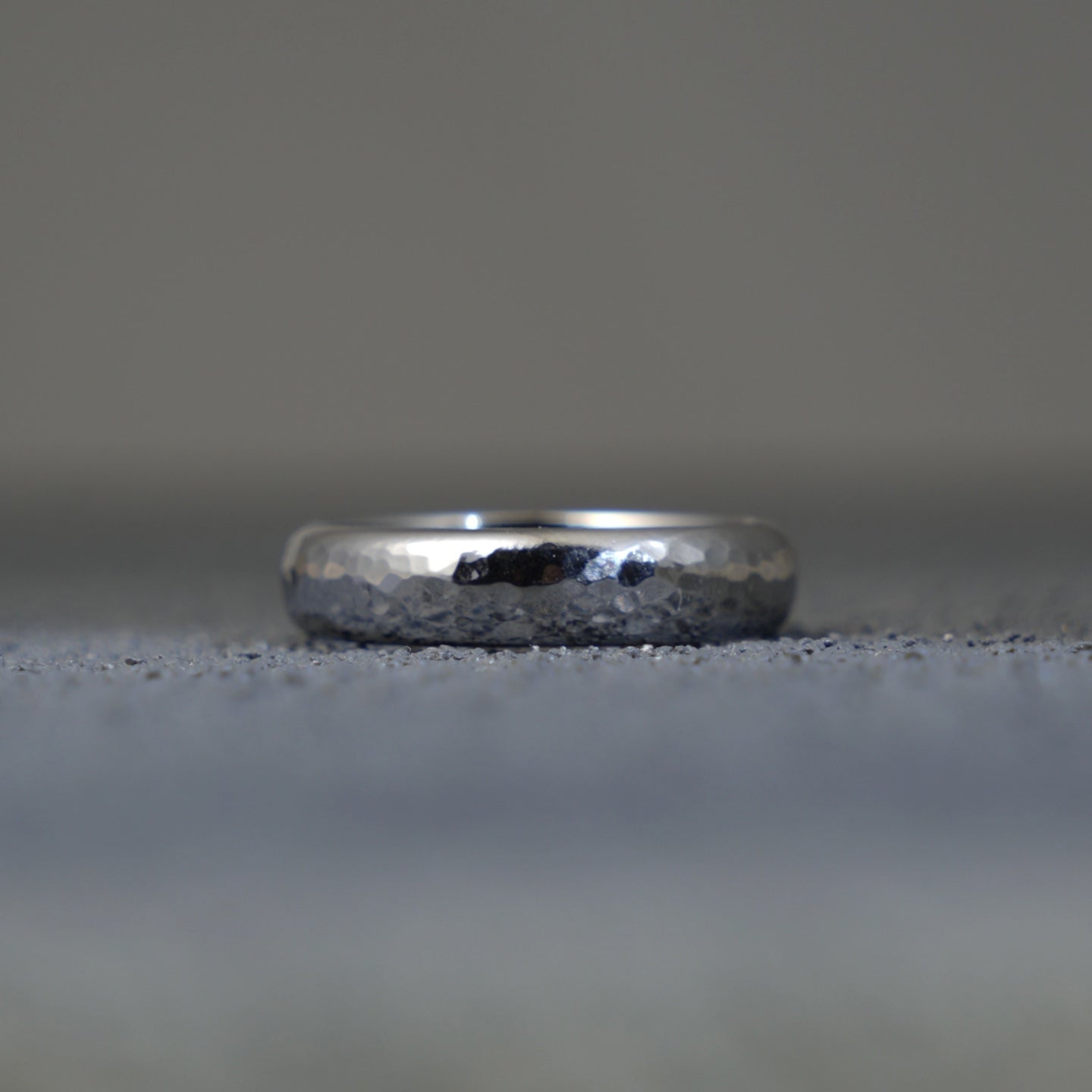 The Rhenium Ring: The Fingerprint of the Forge on Element 75.A Hand-Hammered, Custom-Forged Band of Scientific Artistry.